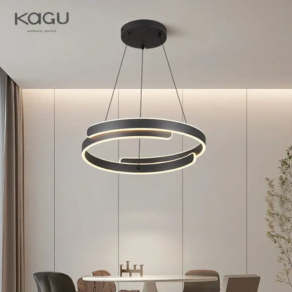 Modern black kagu pendant light with sleek overlapping circular rings and illuminated edges for decorbites black white led chandelier