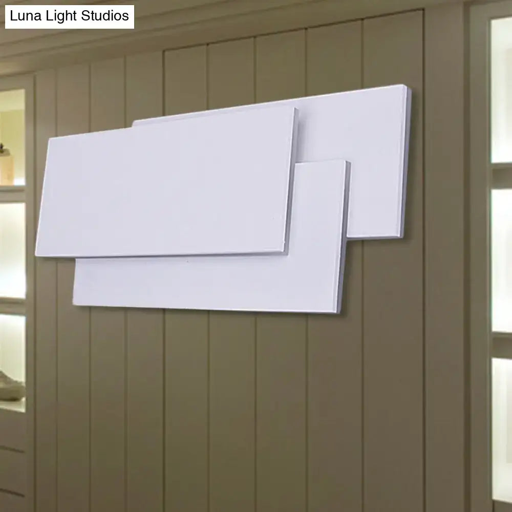 Modern black and white led wall lamp fixture height 5in with white rectangular canvas art pieces on wall
