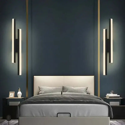 Modern black and white led wall sconce lamp with sleek vertical led strips and black frame mounted beside bed