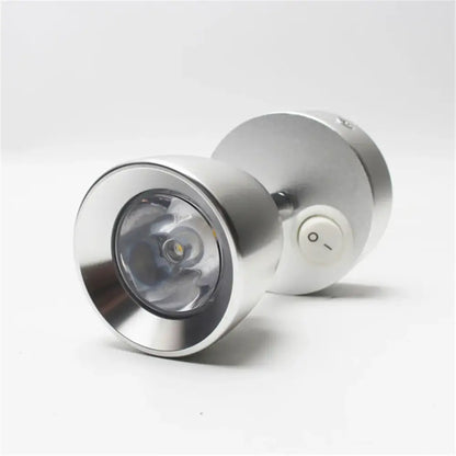 Silver metallic led spotlight wall lamp with circular lens and white power button for decorbites led wash reading use