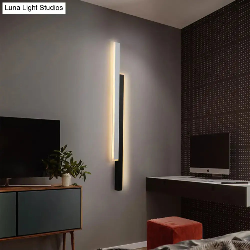 Modern black and white linear led wall light with a sleek frame and warm led lighting for corridor use