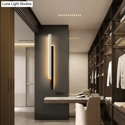 Modern black and white linear led wall light with slim black frame and warm ambient lighting for corridor use