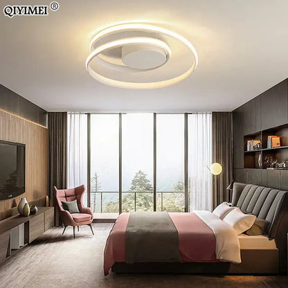 Modern black and white minimalist ceiling light featuring a white circular led ceiling light with concentric ring design
