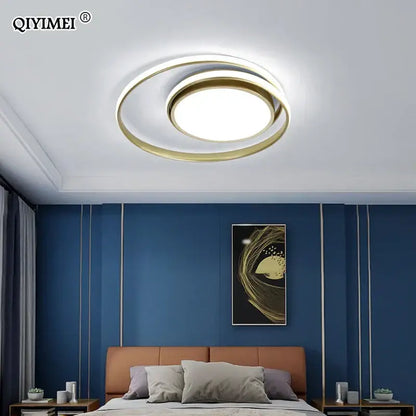 Modern black and white minimalist led ceiling light with gold-toned circular rings and bright central led panel decorbites ceiling light
