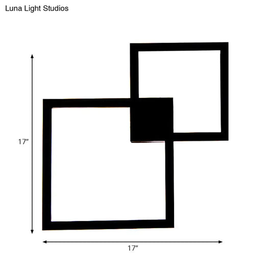 Modern black wall sconce with two overlapping 17 inch acrylic shade squares for dining room decor