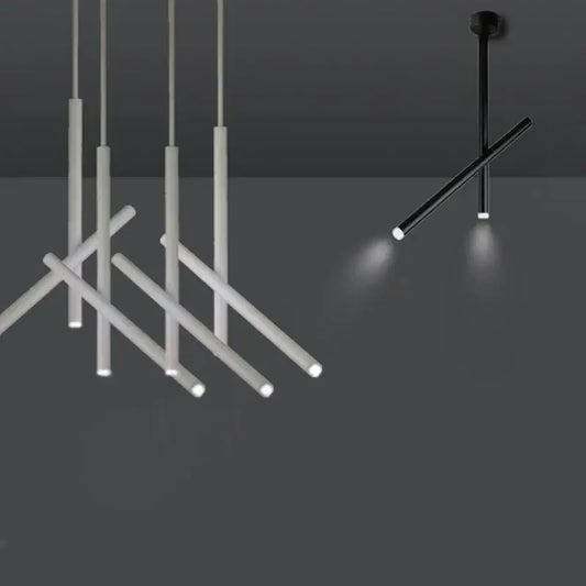Modern black and white pendant light with sleek cylindrical rods and pipe erected installation for focused illumination