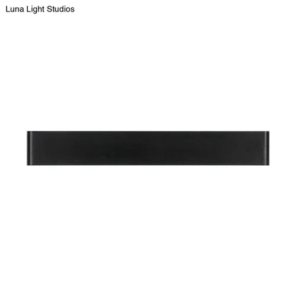 Modern black and white wall lamp with a sleek rectangular metal shade for living room light fixture use