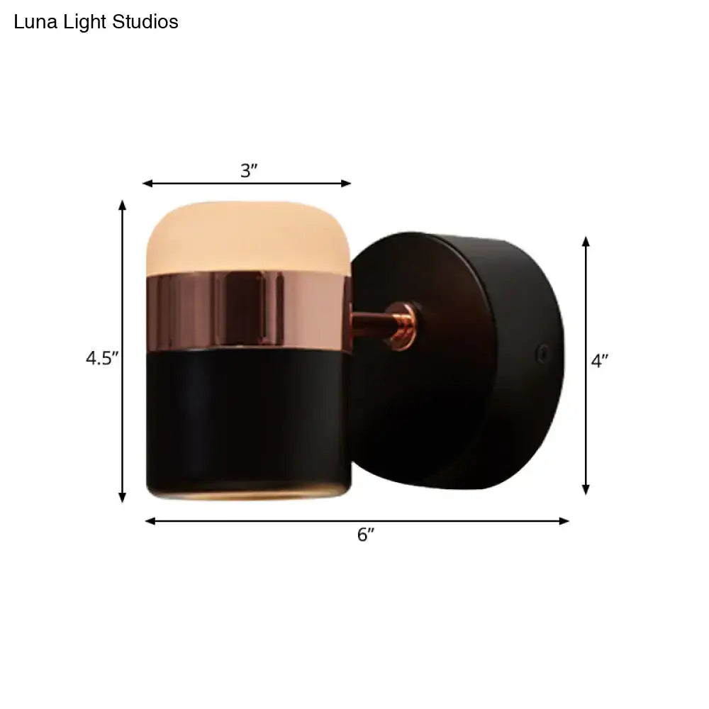 Modern black and white rotatable led bedroom wall sconce with rose gold accents and frosted glass diffuser