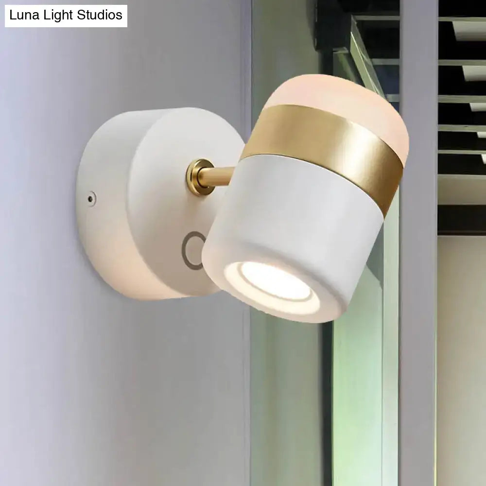 Modern black and white rotatable led spotlight with a white matte finish and gold accent for bedroom wall lighting