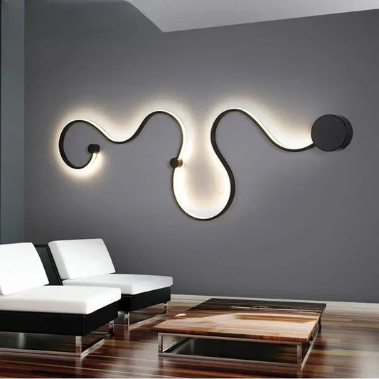 Modern black metal wall lamp with flowing sculptural curves and warm ambient lighting for decorbites contemporary acrylic wall use