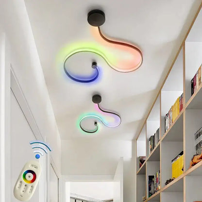 Two modern black wall lamps with curved acrylic bodies emit vibrant rainbow light for contemporary bedroom decorbites decor