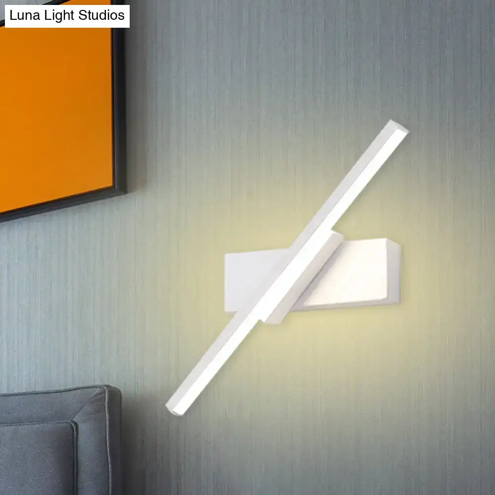 Modern black and white slim led wall sconce with sleek angular design and minimalist rectangular base for bedroom lighting