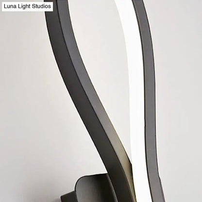 Modern black and white twisted wall light sconce with sleek curved design and integrated led strip for 110v-120v use
