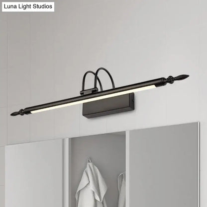 Black metal vanity lighting with sleek elongated design and ornate finials emitting white warm light for bathroom use