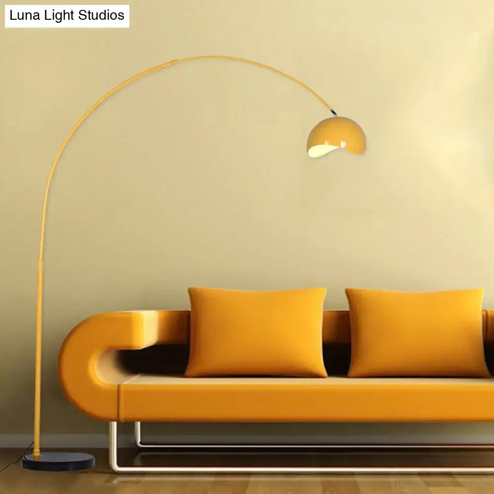 Yellow arched floor lamp with sleek curved metal frame and rounded dome shade in black yellow led incandescent fluorescent compatible