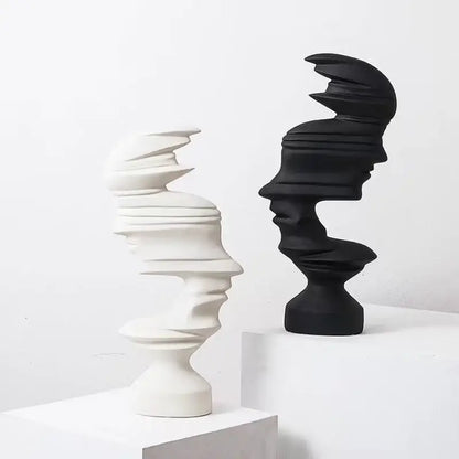 Elegant abstract human face sculptures in matte white and black with layered spiraling contours for decorbites abstract human face living room decor
