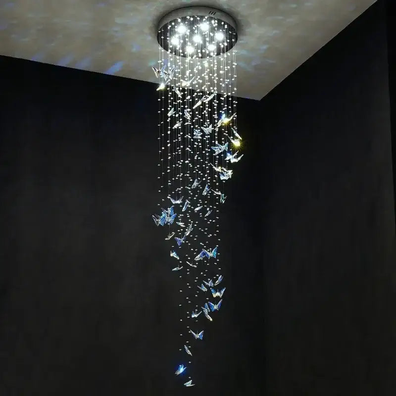 Modern blue and clear butterfly crystal chandelier with circular mount and cascading decorbites butterfly crystals lighting staircase