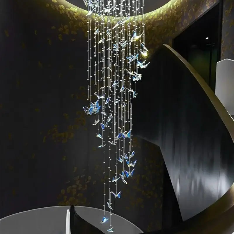 Elegant modern blue and clear butterfly crystal chandelier with cascading strands from golden ceiling fixture decorbites butterfly crystal