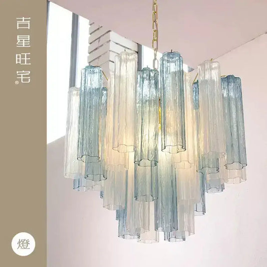 Modern blue and clear colorized glass led chandelier with cascading translucent tubes and gold-toned chain for living room decorbites colorized glass