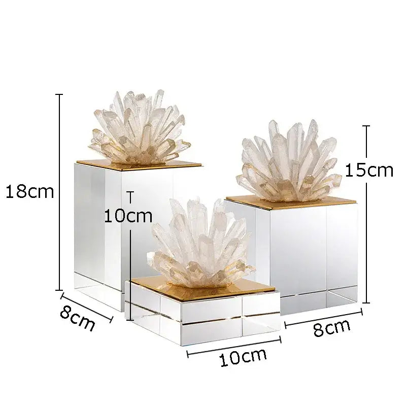 Set of three modern decorbites crystal flower sculptures with gold tops on marble base and translucent quartz crystals