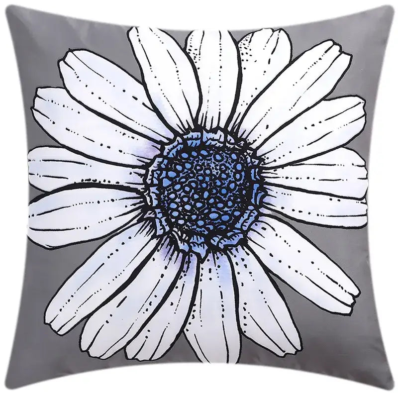 Gray cushion cover featuring a stylized white daisy with a detailed blue center for decorbites blue floral living room decor