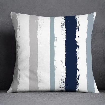 Modern blue geometric floral design throw pillow with bold white gray light blue and navy vertical stripes and textured finish