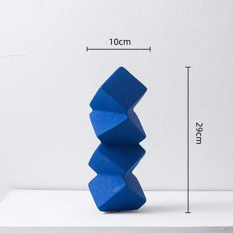 A vibrant blue geometric square ceramic sculpture stack with textured angular facets for modern living room decorbites decor
