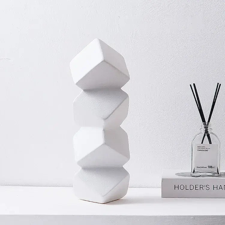 White geometric ceramic sculpture stack with faceted segments for modern decorbites geometric square living room decor