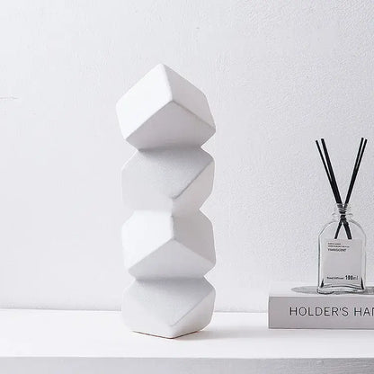 White geometric ceramic sculpture stack with faceted segments for modern decorbites geometric square living room decor
