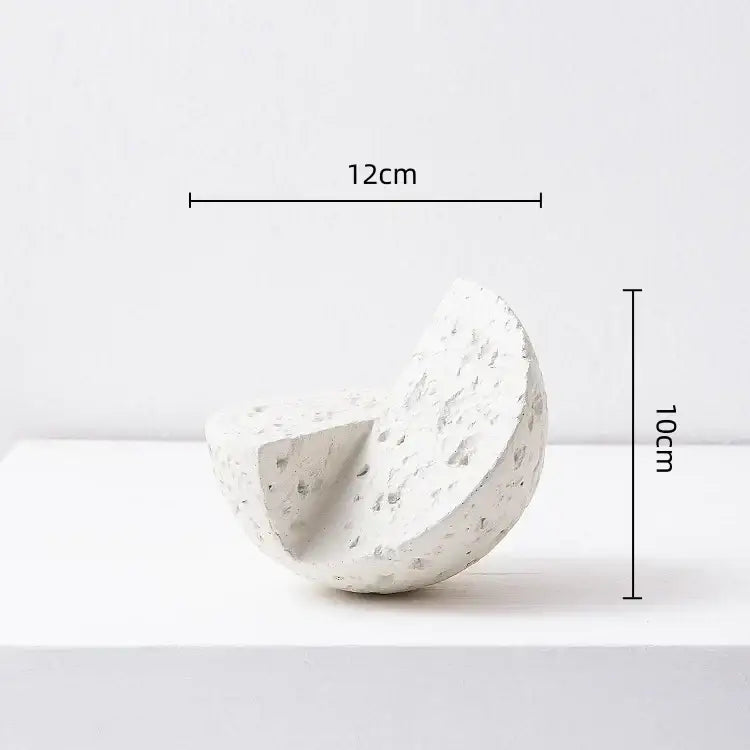 White textured concrete half-sphere decorative object complementing modern blue geometric square sculpture stack decorbites decor
