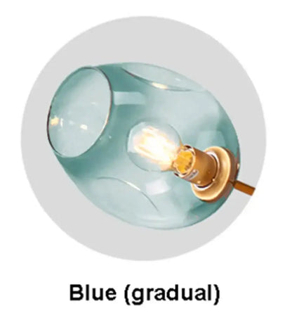Modern blue glass black gold pendant light featuring a translucent blue gradient glass and warm black gold pendant fixture