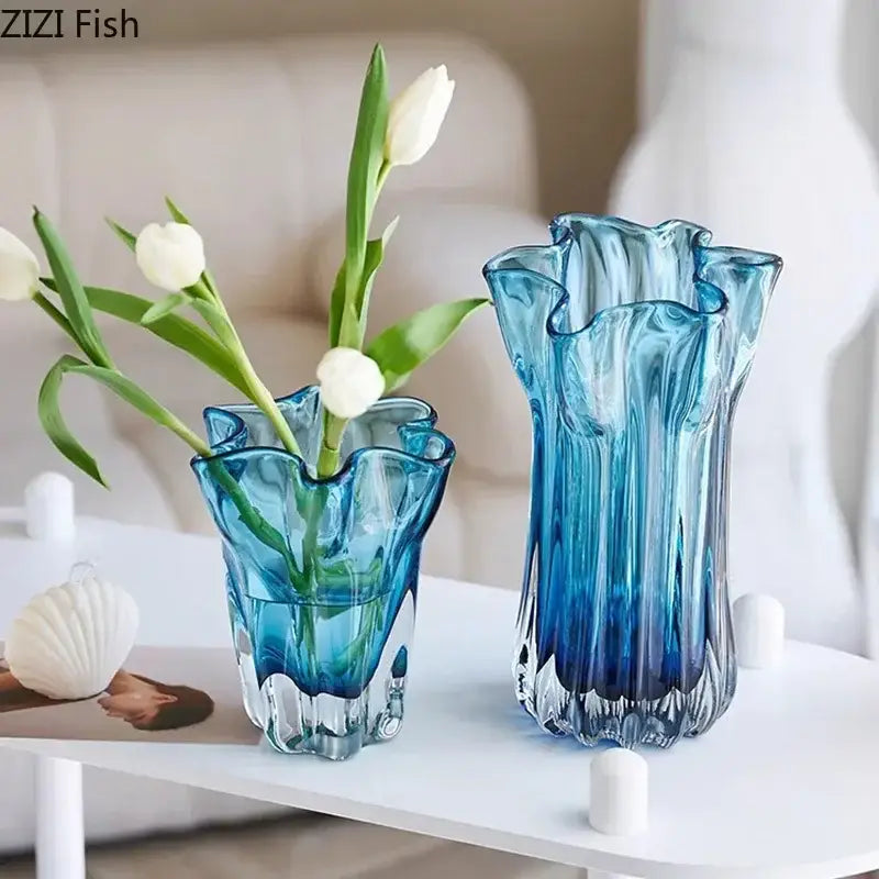 Two translucent blue glass hydroponic vases with ruffled rims and faceted bases for modern office decorbites decor