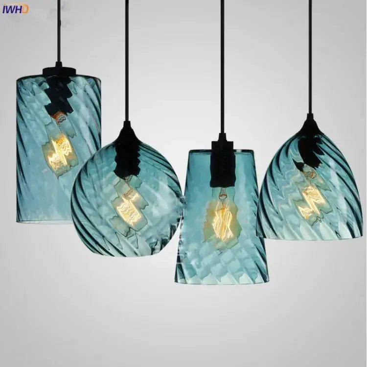 Set of four teal glass led pendant lights with swirling texture and exposed filament bulbs for dining room lighting