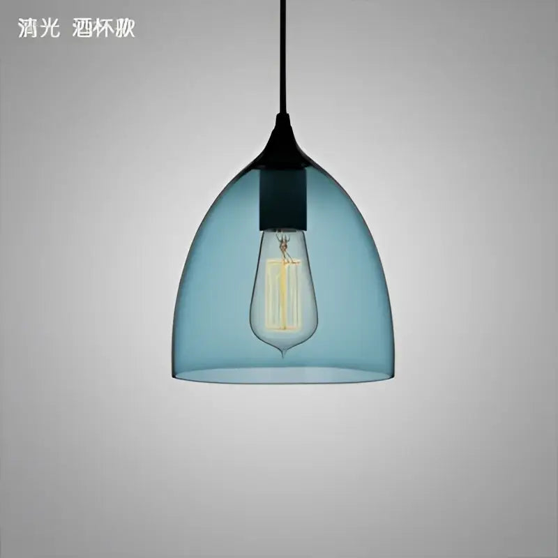 Modern blue glass led pendant lamp featuring a visible filament bulb ideal for dining room lighting