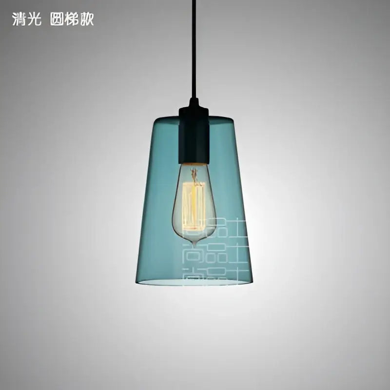 Teal glass led pendant lamp with black metal fixture and exposed filament bulb for modern dining room lighting