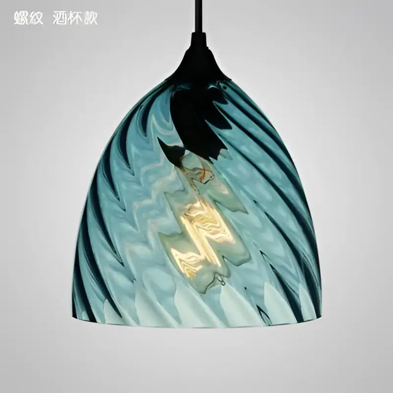 Modern blue glass led pendant lamp with swirling patterns and visible filament bulb for dining room lighting