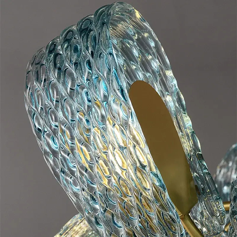 Modern blue glass led pendant lamps featuring a translucent textured bubble pattern with gold-toned accents for decorbites blue glass lighting