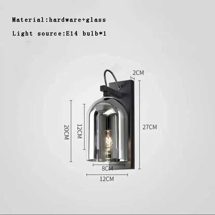Modern blue glass wall lamp pair with black metal and brass sconces featuring bell-shaped clear glass dome housing bulb