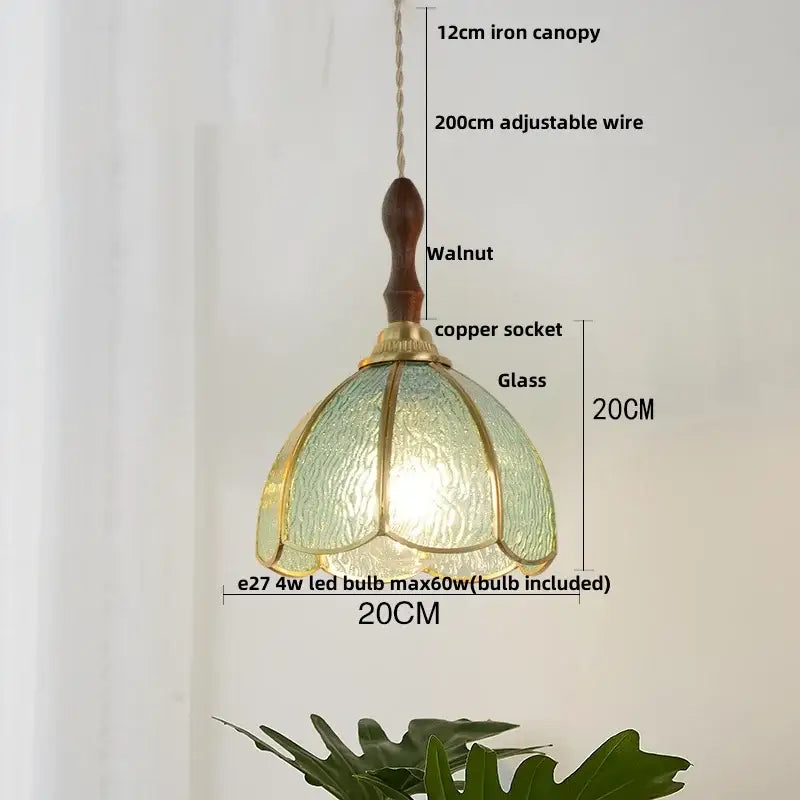 Modern blue and gold butterfly glass led pendant light with a textured green glass shade and brass accents decorbites butterfly glass pendant light