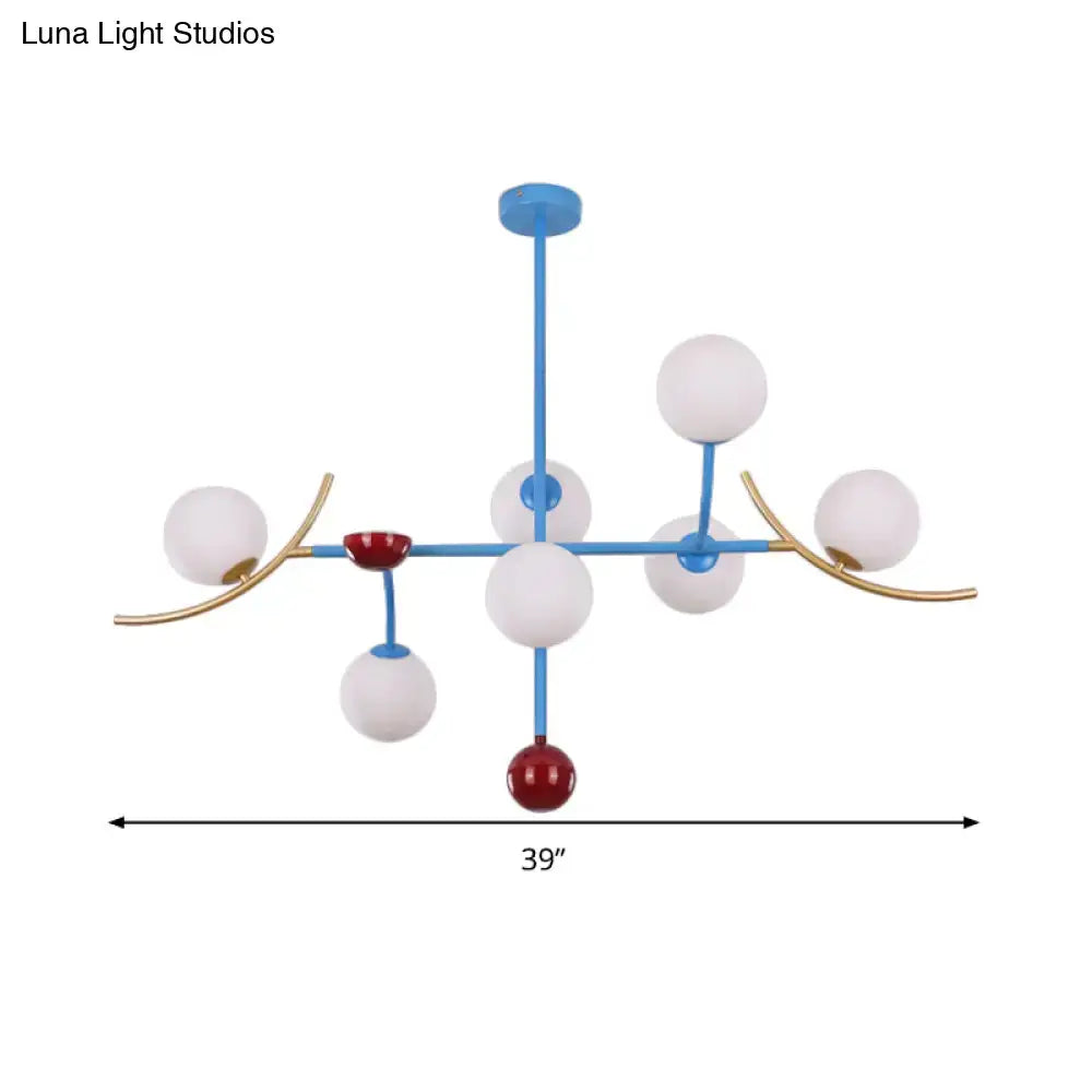 Modern blue and gold lamp fixture with opal glass balls and red accents for dining room glass ball island lighting