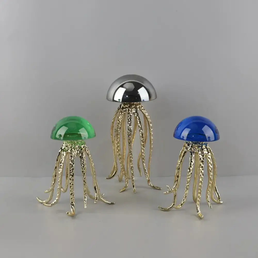 Three decorbites crystal jellyfish sculptures with gold tentacles and green silver blue domes for living room decor