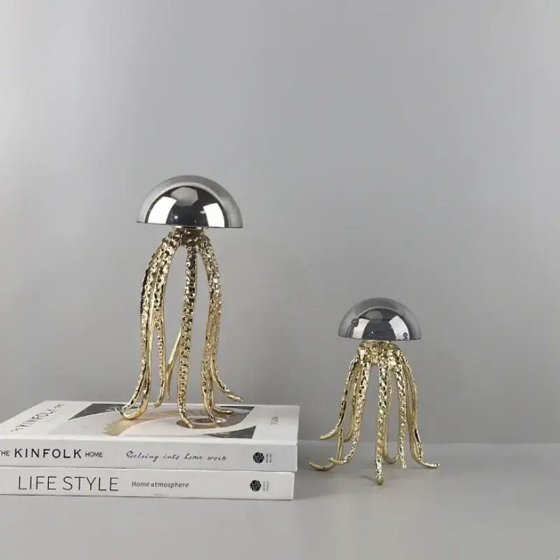 Two metallic decorbites crystal jellyfish sculptures with silver and gold finishes for modern living room decor