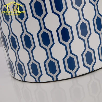 Modern blue orange table lamp with a blue and white geometric ceramic planter featuring a glossy finish for decorbites blue orange decor