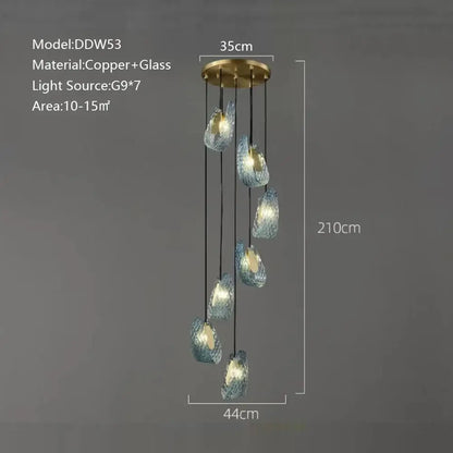 Modern blue peacock leaf glass chandelier with seven iridescent blue-green teardrop shades on brass fixture for dining room decorbites