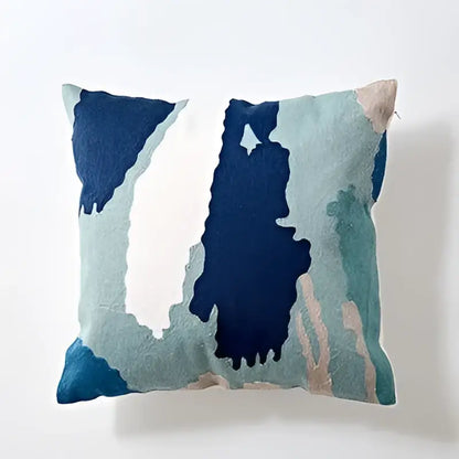 Modern blue and white embroidered geometric cotton cushion cover with abstract painterly design for bedroom use