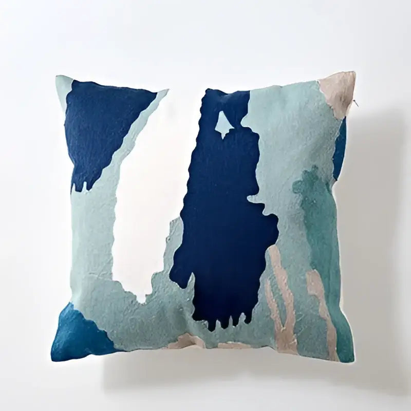 Modern blue and white embroidered geometric cotton cushion cover with abstract painterly design for bedroom use