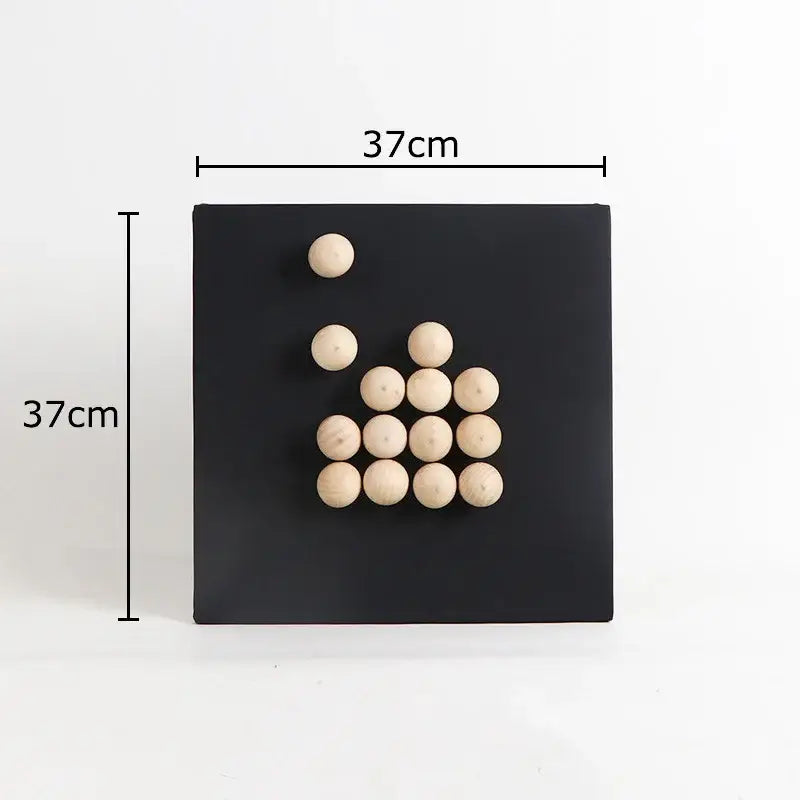 Modern blue and wood ball hanging wall decor featuring light wood balls arranged in pyramid on black magnetic board