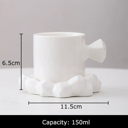 White ceramic decorbites bowknot decor porcelain cup with geometric faceted handle and cloud-shaped base for dining room use