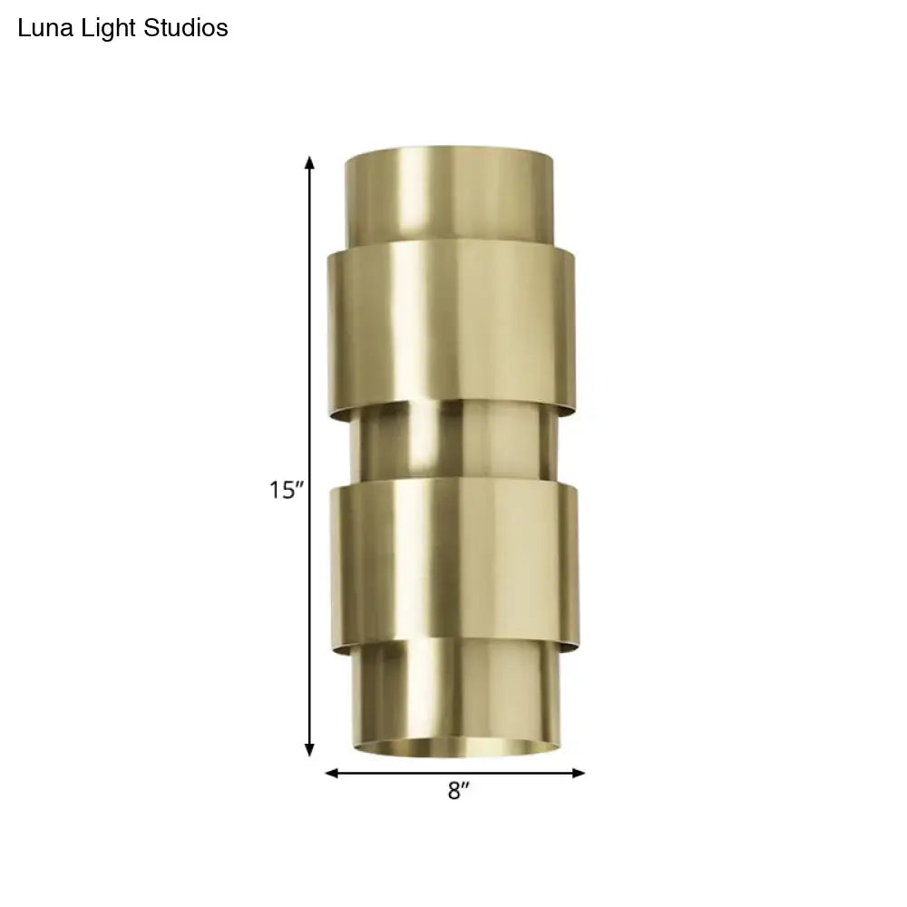 Modern brass 3 tier metal shade wall sconce with a geometric cylindrical design for foyer lighting