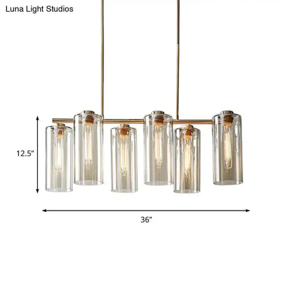 Modern brass 5 light chandelier with cognac glass shades and exposed bulbs ideal for dining room island light